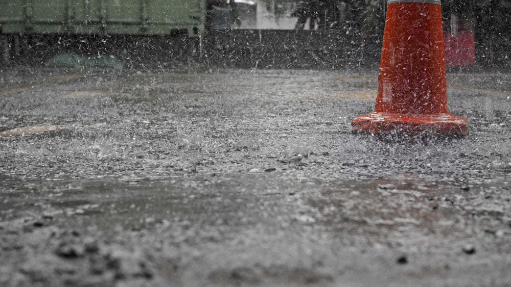 Pouring concrete in the rain.