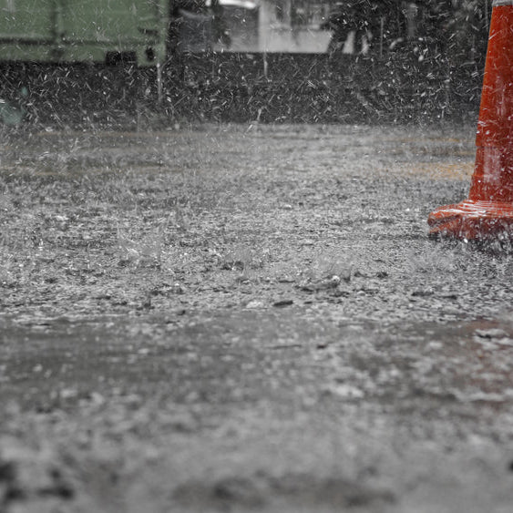 Pouring concrete in the rain.