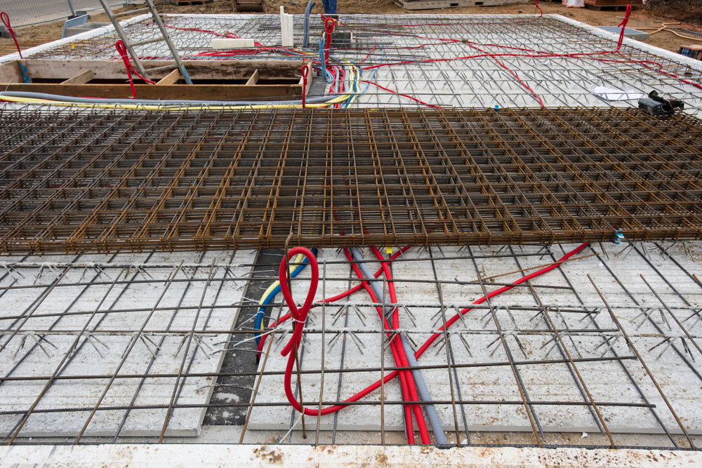 Wire mesh reinforcement installed on a concrete slab before the concrete pour.